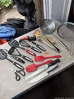 All kitchen utensils laid out on table