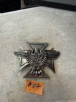 Front view showing eagle over cross design