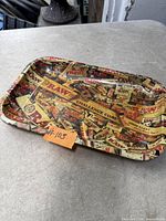 Top view of RAW branded metal rolling tray showing graphic design and size
