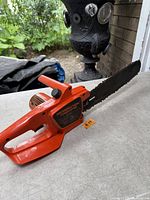 Full view of Remington Powercutter electric chainsaw on table