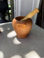Wood mortar and pestle set showing form and condition