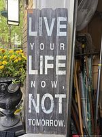 Full view of wooden wall sign showing text and condition