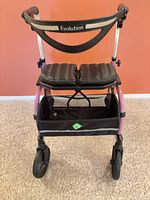Front view of Evolution rollator showing frame color, wheels, seat, basket
