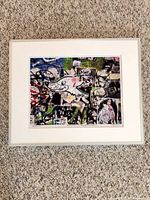 Full view of framed street art print, white mat, silver frame