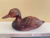 full profile of wooden duck decoy left side