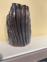 Front view showing vertical grooves and color