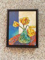 Front view of framed oil painting showing tulip subject and signature