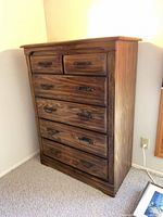 Three-quarter view of dresser showing drawer arrangement and finish