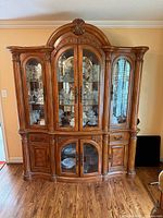 Full front view of china cabinet displaying design and scale