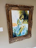 Framed portrait painting on wall