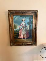 Full view of framed portrait on wall