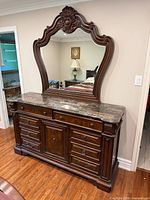 front view of dresser with marble top and mirror attached
