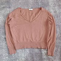 Full front view of sweater showing design and color