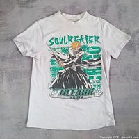 Front view of T-shirt laid flat showing full graphic