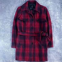 Front view of red and black plaid Jacob coat with belt
