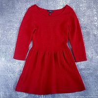 Full front view of the long sleeve dress laid flat