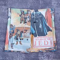 Front view of shorts showing Darth Vader and Ewok graphics, drawstring waist visible