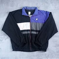 Front view of the colour-block Norton Pro windbreaker jacket