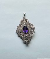 Front view of filigree pendant-brooch