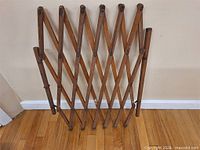 Full view of folded wooden accordion gate