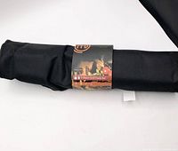 Rolled apron/carrying case with MasterChef branding sleeve front view