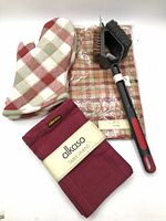 Full set showing oven mitts, banded table linens, packaged apron, grill brush