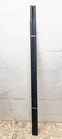 Pair of black rectangular steel handles tied together