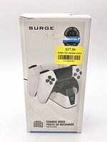 Front of retail box showing Surge Charge Dock for PS5 with image of dock and controllers