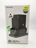 Front of retail box showing Surge charge stand with Series X console and controllers