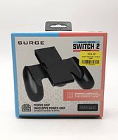 Front of boxed Surge Power Grip showing product image, branding, battery capacity