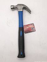 Full view of hammer front side showing handle colors and head