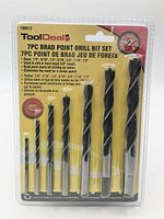 Front view of sealed ToolDeal 7-piece brad point drill bit set showing all bits and packaging