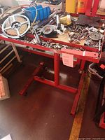 Overall view of red stand holding mixed hardware, tools and LED reel
