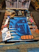 Overview of entire lot on pallet: banner, phones, filter, hardware, heating element, baby mat