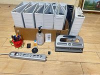 Binders, hole punch, power strip, pen holder, sanitizer, small parts