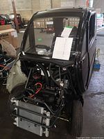 Front view showing missing panels and exposed radiator