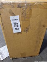 Sealed shipping box with MaxSold label