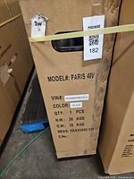 Carton end showing model, color, VIN, weight