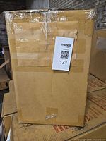 Sealed cardboard box containing Dosun rack and bag, shows lot tag 171