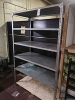 Full view of galvanized steel shelving unit with five shelves