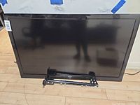 Front view of Haier flat-panel TV showing screen, bezel and size