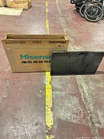 TV screen and original Hisense box