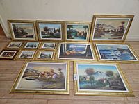 Group shot of all 12 framed prints laid out on floor