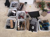 overview of eight tubs with hand tools, fasteners, electrical items