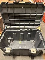 Open Stanley rolling job chest showing interior and lid structure