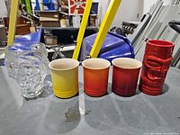 Front view of all five mugs lined up