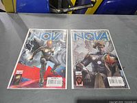 Front view of both Nova comics in bags and boards