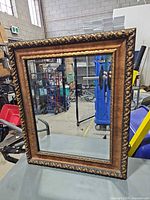 Front view of mirror showing frame design and glass