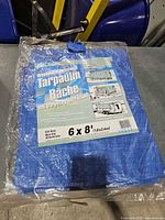 Front view of packaged Pit Stop tarp showing brand, size and material