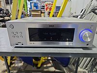 Front view of RCA RT2760 receiver showing display, controls, ports